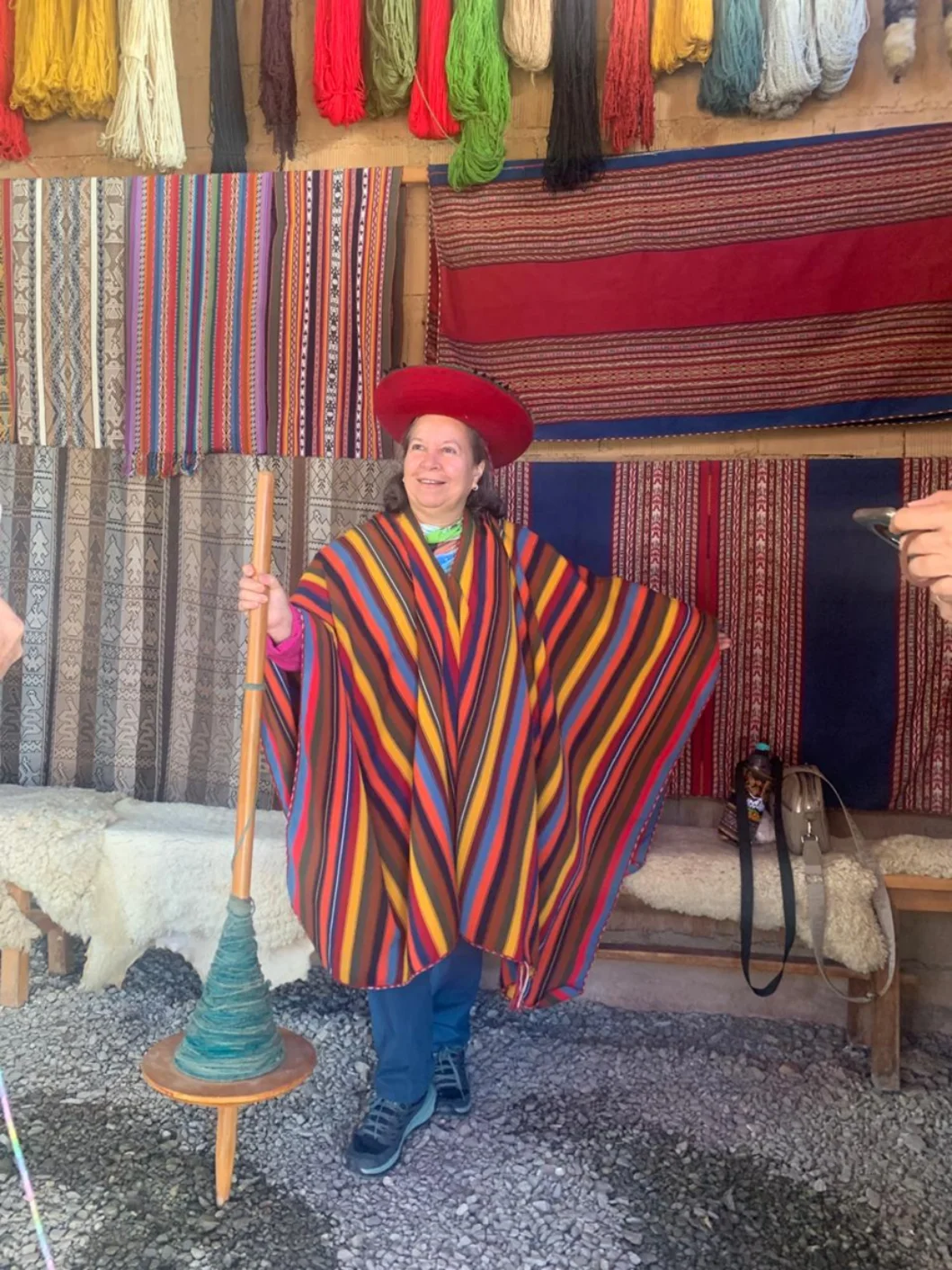 Traveler wearing traditional Andean clothing at a textile center in Chinchero, Sacred Valley