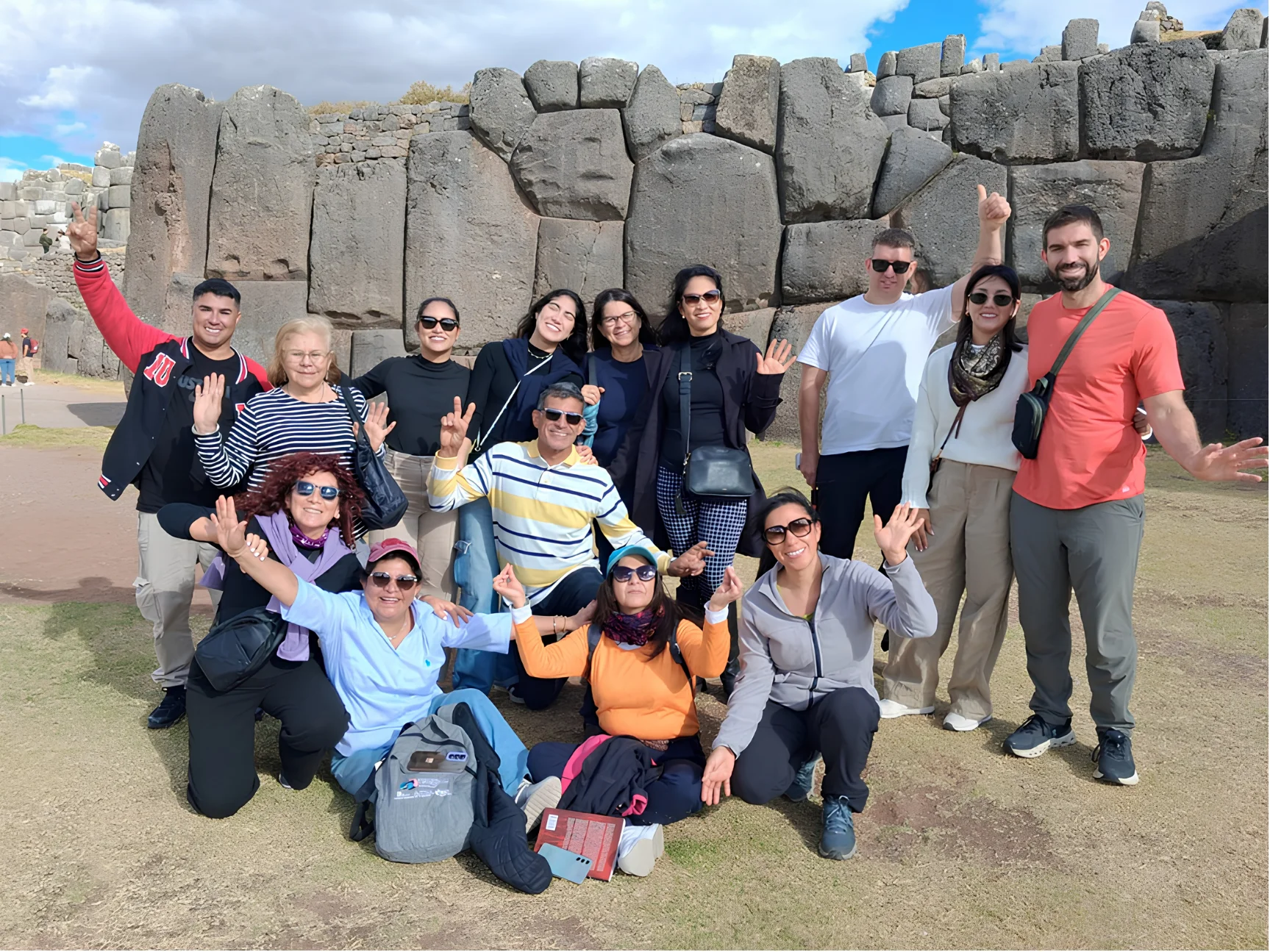 Travelers on the Cusco City Tour in front of the massive Inca stone walls at Sacsayhuaman.