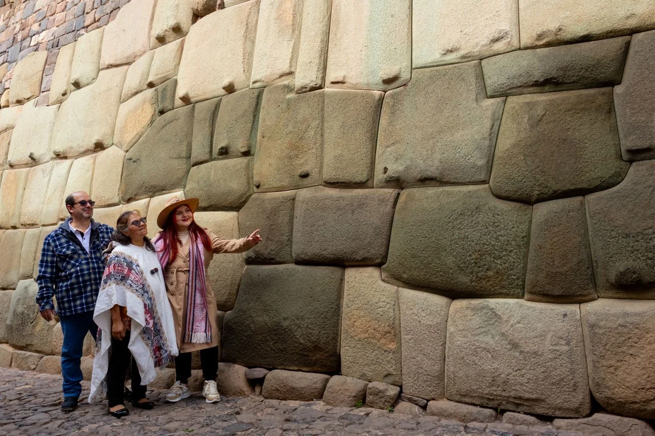 Traditional Inca stone wall illuminated by warm sunlight in the historic center of Cusco