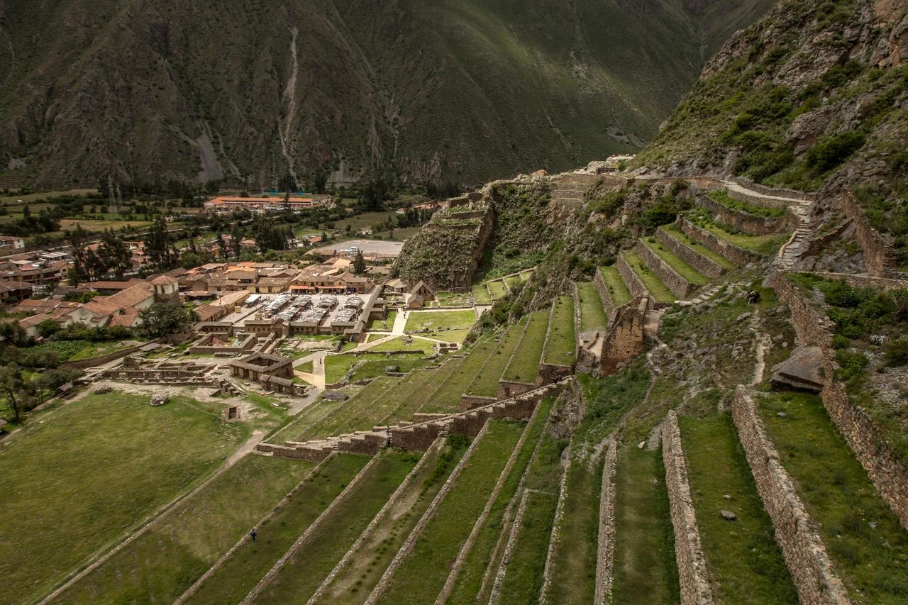 Panoramic view of the Inca terraces and archaeological complex of Ollantaytambo in the Sacred Valley of Peru.