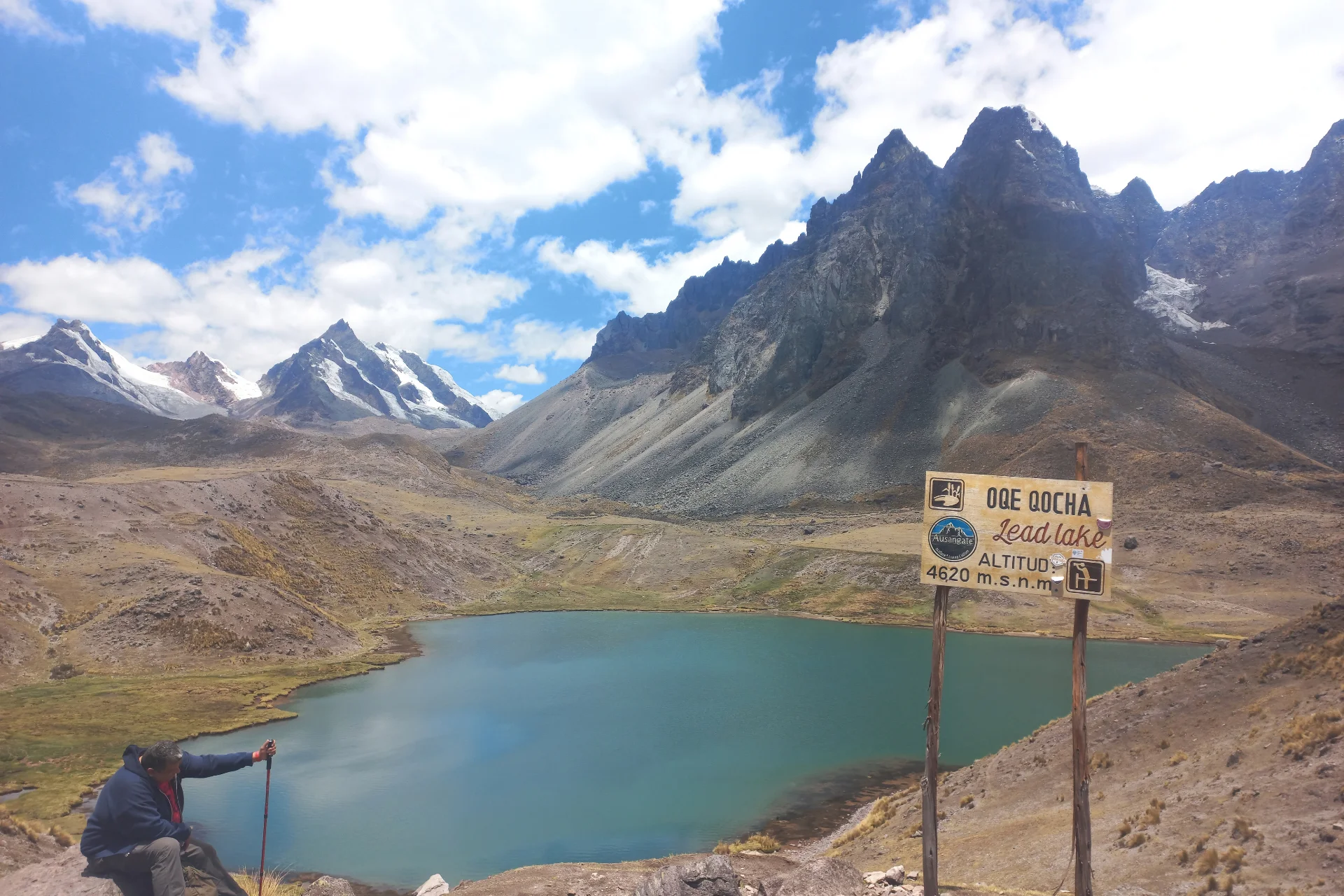 View of Oqe Qocha lake and its mountain landscape along the Ausangate 7 Lakes hiking route in Cusco.