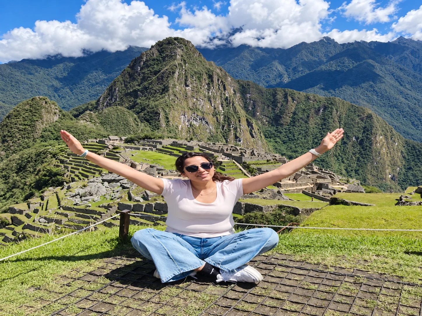 Woman overlooking Huayna Picchu and the Machu Picchu citadel