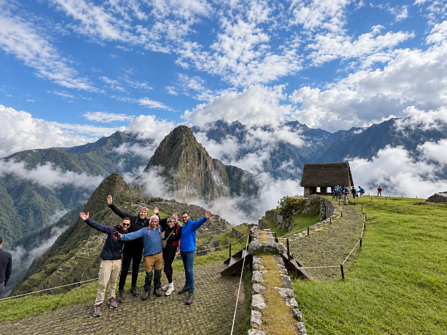 Group of hikers on the stone path of the Classic Inca Trail to Machu Picchu