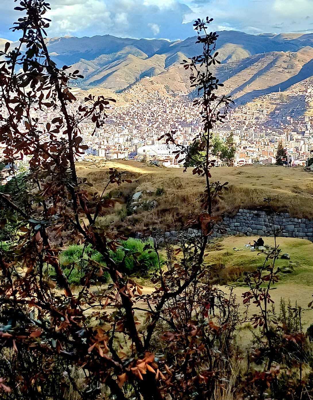 Panoramic view across the city of Cusco from the archaeological hills above the historic center.