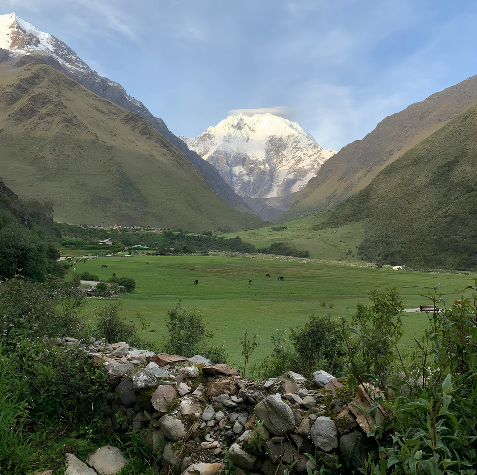 Green Andean valley surrounded by mountains along the Salkantay Trek 5 Days to Machu Picchu.