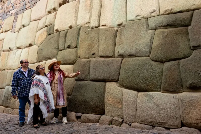Traditional Inca stone wall illuminated by warm sunlight in the historic center of Cusco