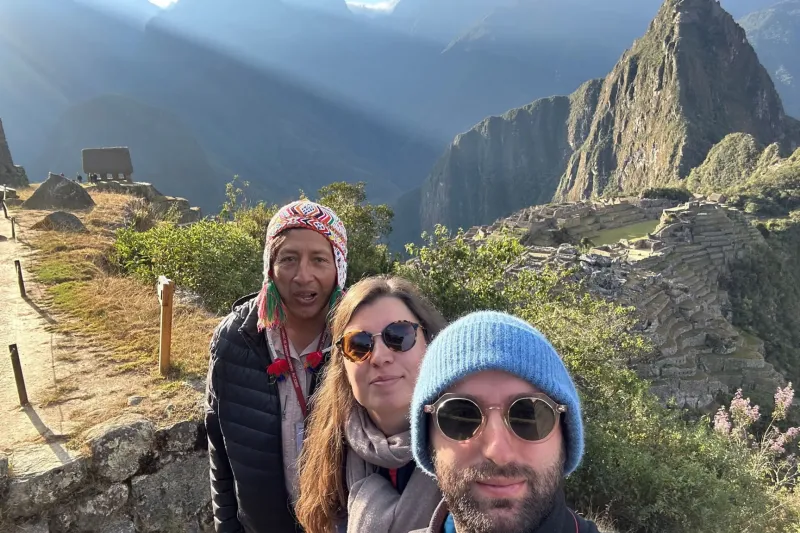Travelers enjoying Machu Picchu on the final stage of the Salkantay Trek 5 Days.