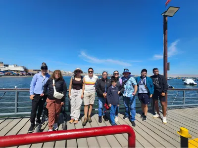 Travelers at the Paracas pier before their Ballestas Islands boat tour.